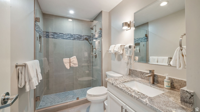 1364 Still Water Drive, Unit R2012 Heber City, UT 84032 - Photo 22 of 30 Bathroom featuring a glass-enclosed shower with tile surround and mosaic accent band