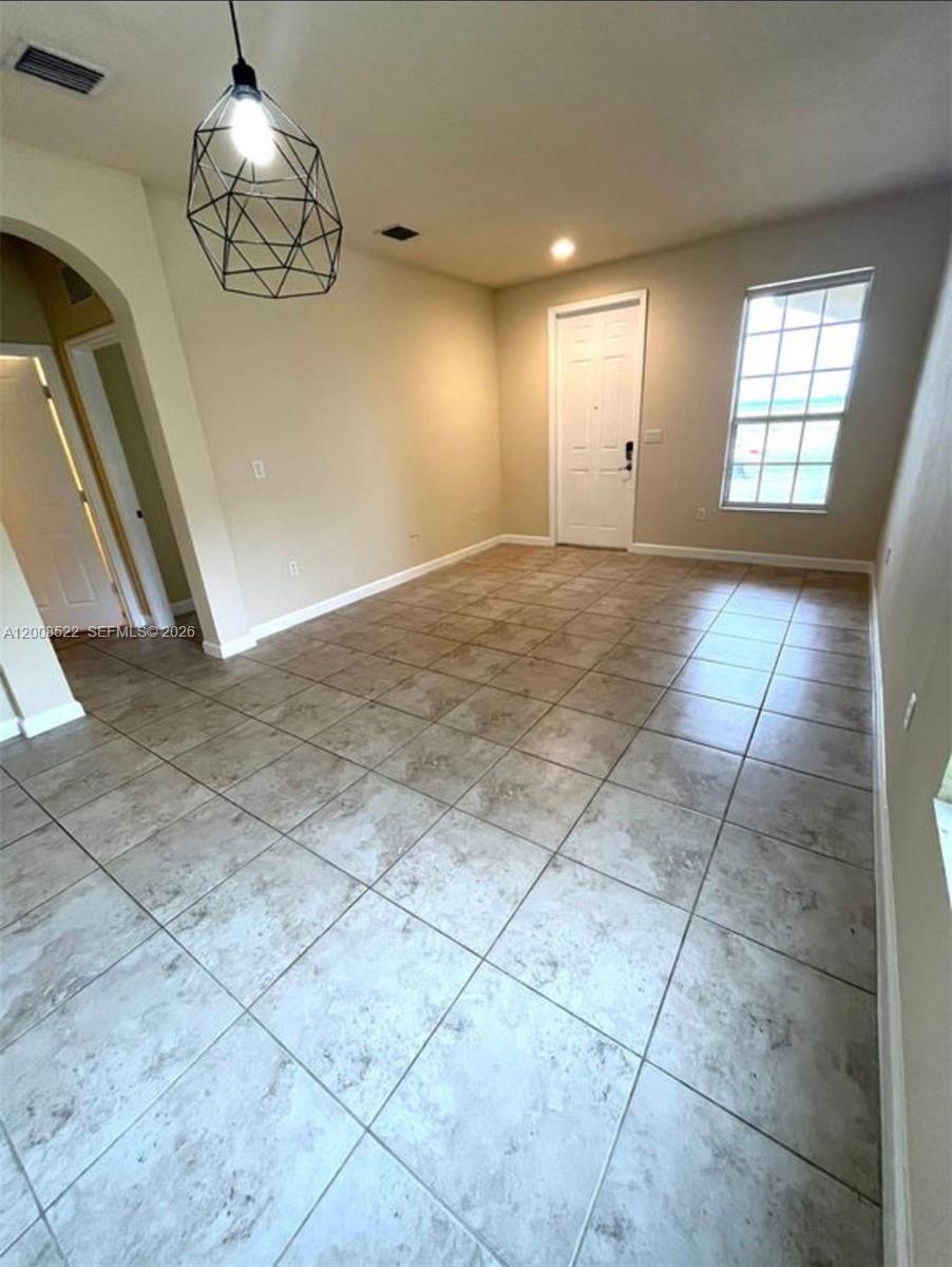 9401 Southwest 172nd Avenue, Unit 9401 Miami, FL 33196 - Photo 18 of 34 a view of an empty room and window