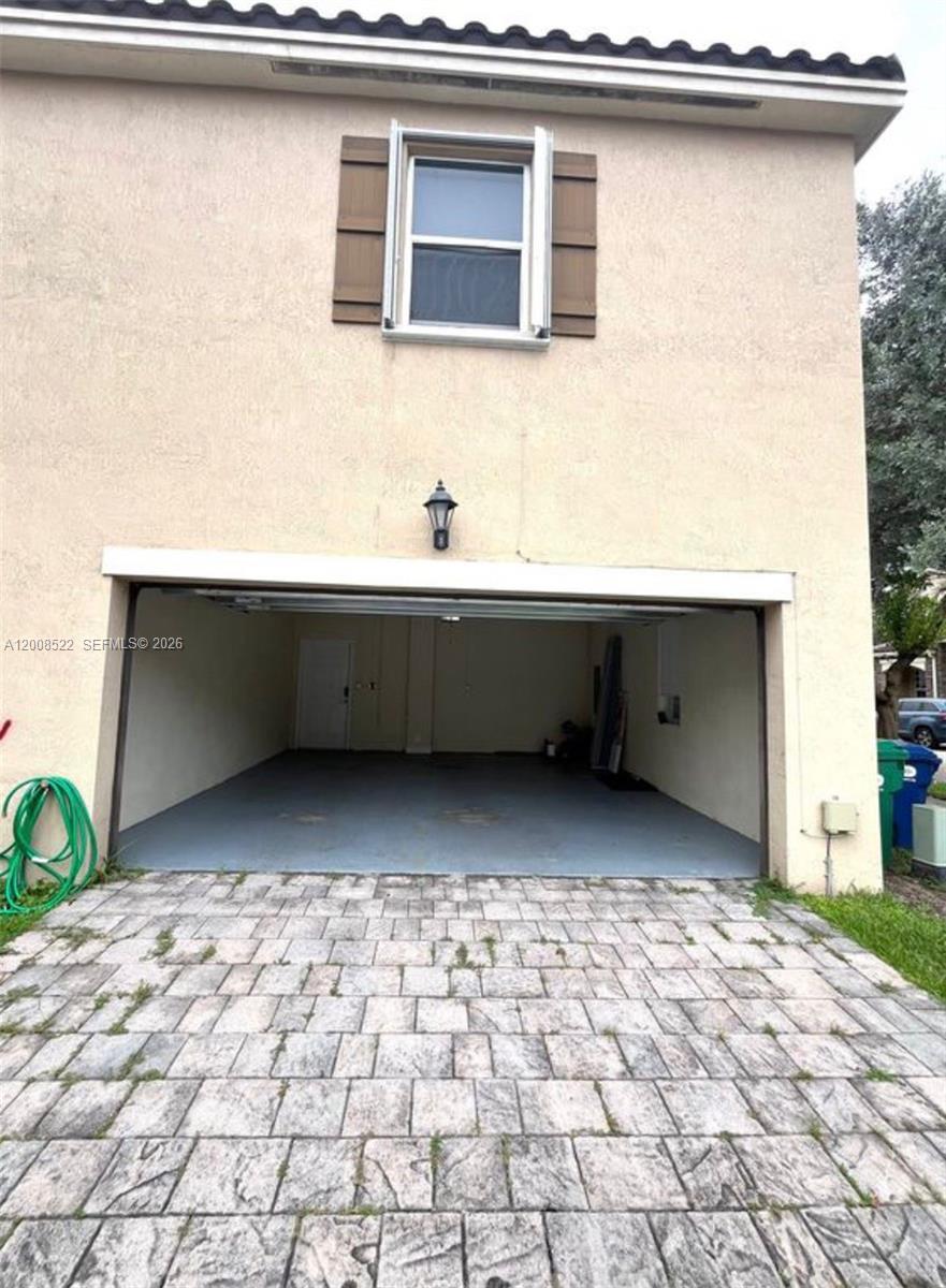 9401 Southwest 172nd Avenue, Unit 9401 Miami, FL 33196 - Photo 29 of 34 a room with a bench and a sink