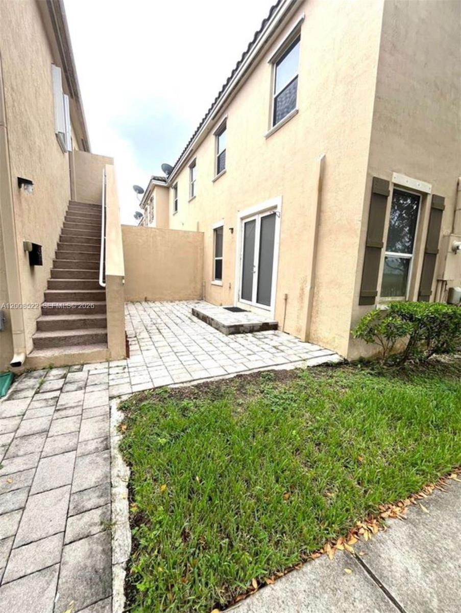9401 Southwest 172nd Avenue, Unit 9401 Miami, FL 33196 - Photo 32 of 34 a view of front door of house