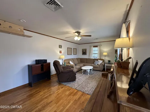 a kitchen with a sink and white cabinets