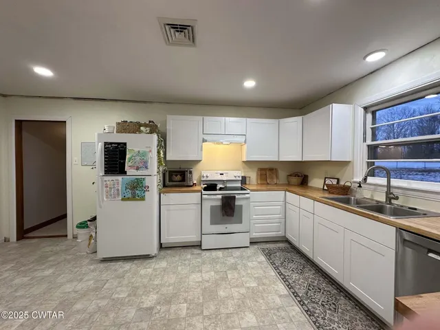 a view of hallway with wooden floor