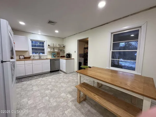 a bedroom with a bed and a desk