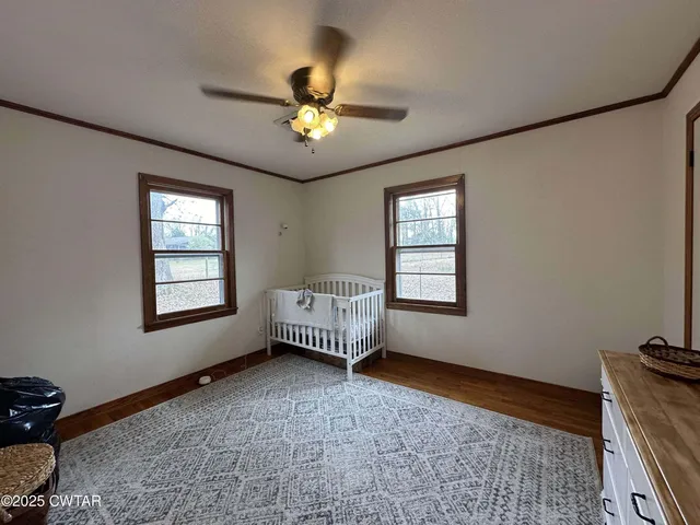 a bedroom with furniture and a chandelier