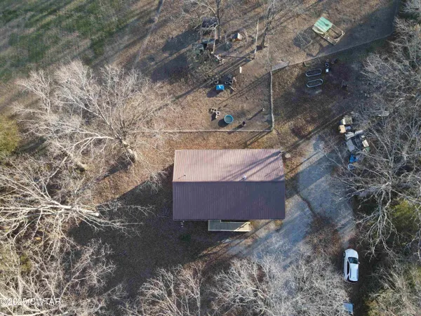 a backyard of a house with barbeque oven