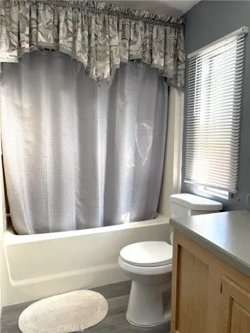 a bathroom with a toilet a sink and bathtub
