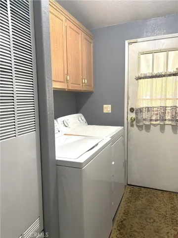 a room with a window and washer