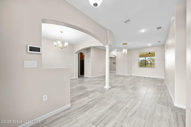 a bathroom with a granite countertop toilet sink and mirror