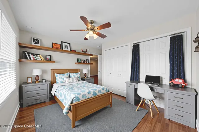 a living room with furniture a rug and a flat screen tv
