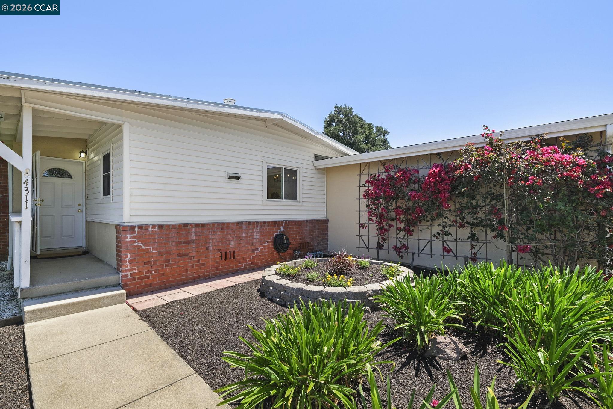 4311 Cowell Road Concord, CA 94521 - Photo 5 of 29 a front view of a house with yard