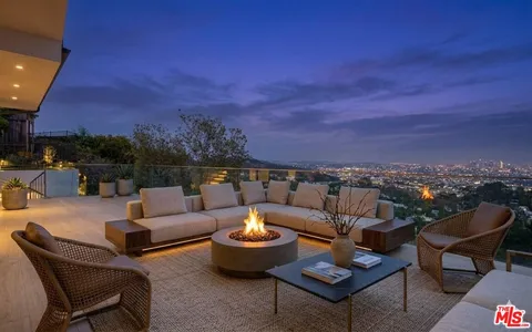 a terrace of a house with outdoor seating