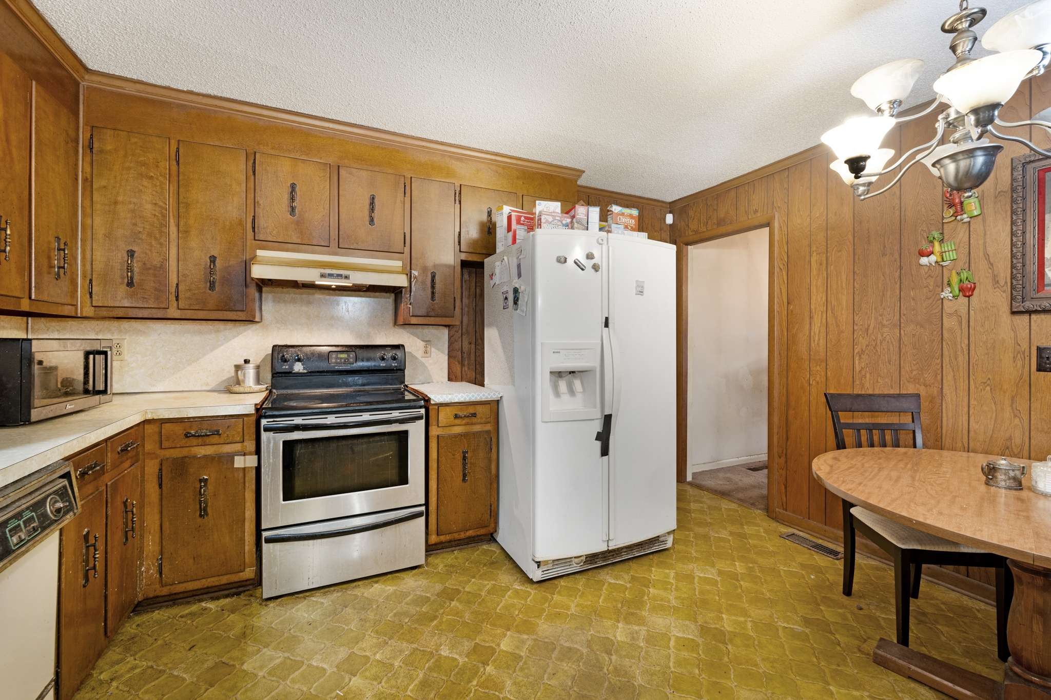 3265 Mt Tabor Road Murfreesboro, TN 37127 - Photo 15 of 30 a kitchen with stainless steel appliances a stove a refrigerator and a sink