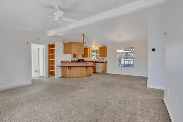 a view of kitchen with a stove cabinets and a kitchen