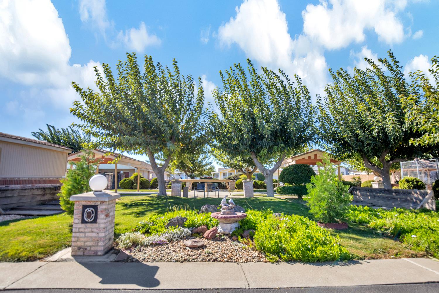 5130 County Road 99W, Unit 82 Dunnigan, CA 95937 - Photo 37 of 39 a front view of a house with a yard