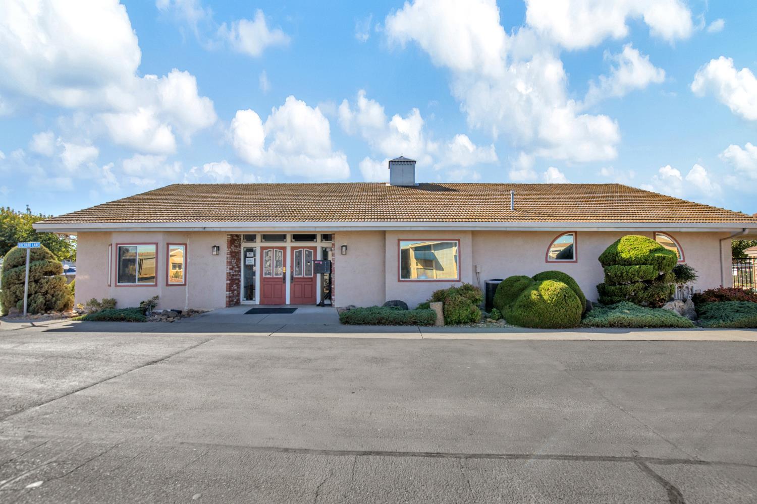 5130 County Road 99W, Unit 82 Dunnigan, CA 95937 - Photo 38 of 39 a front view of a house with a yard and outdoor seating