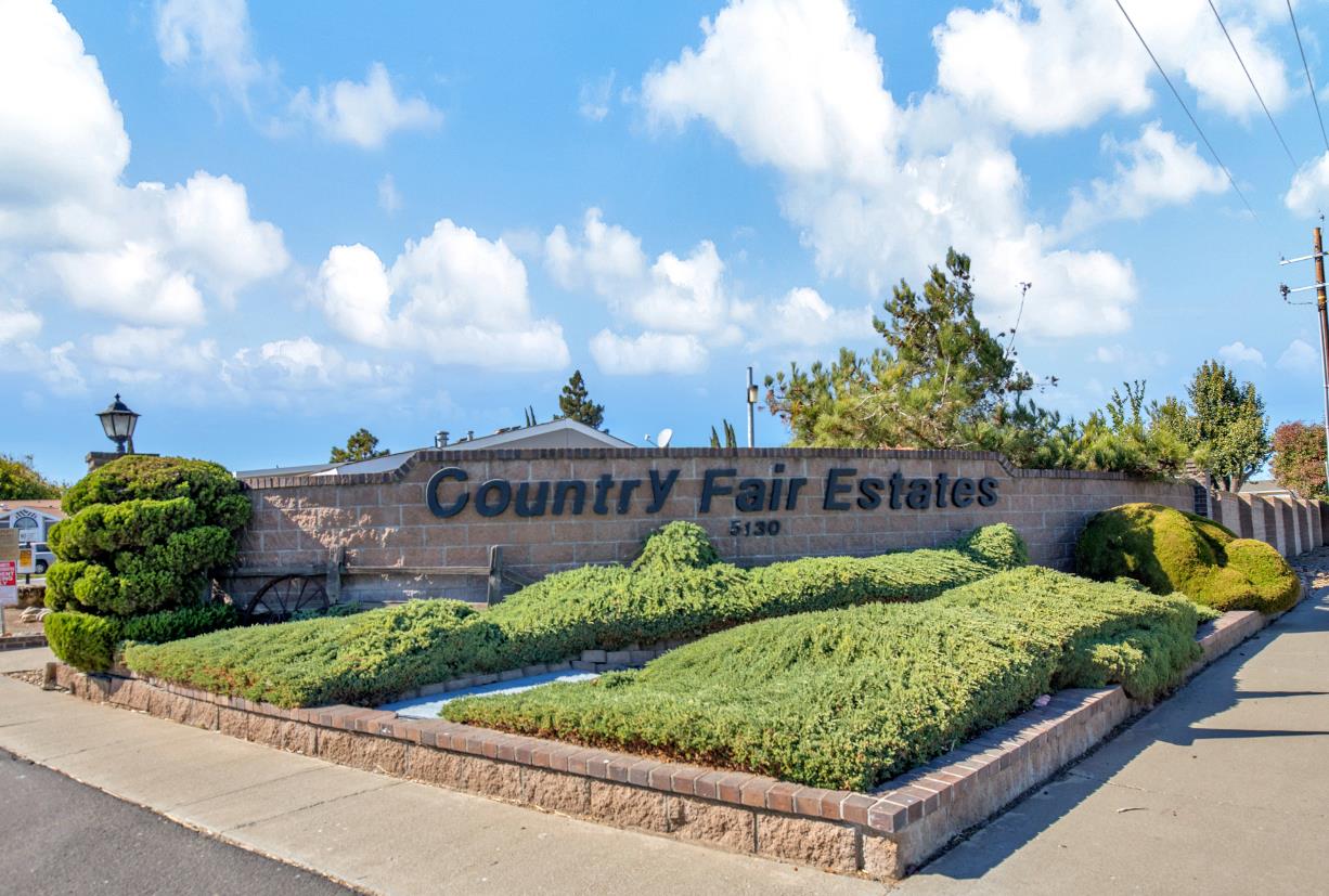 5130 County Road 99W, Unit 82 Dunnigan, CA 95937 - Photo 39 of 39 a view of a garden with a bench in front of house