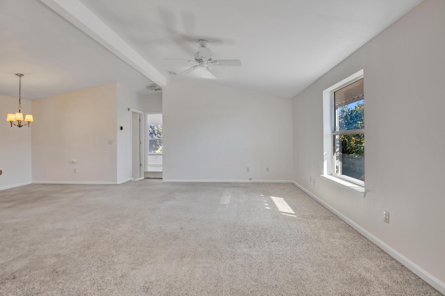 5130 County Road 99W, Unit 82 Dunnigan, CA 95937 - Photo 10 of 39 an empty room with a empty space and windows