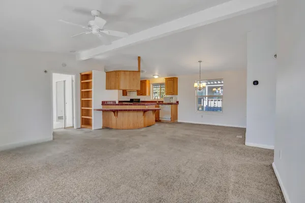 a view of kitchen with a stove cabinets and a kitchen