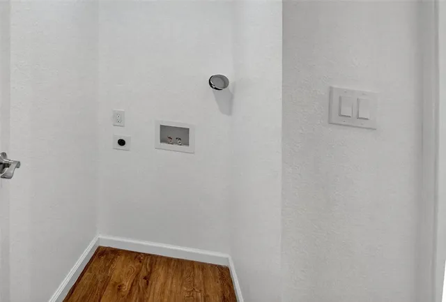a kitchen with stainless steel appliances a refrigerator and a ceiling fan