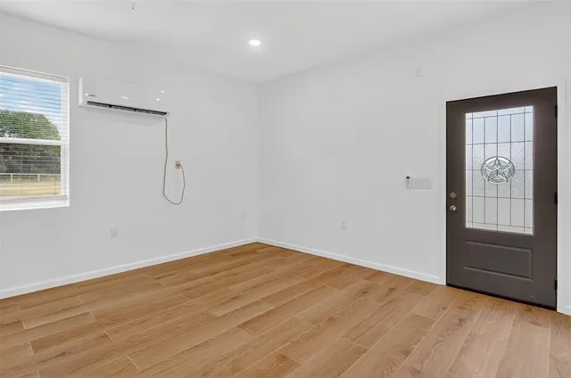 a view of a kitchen with a sink and a refrigerator