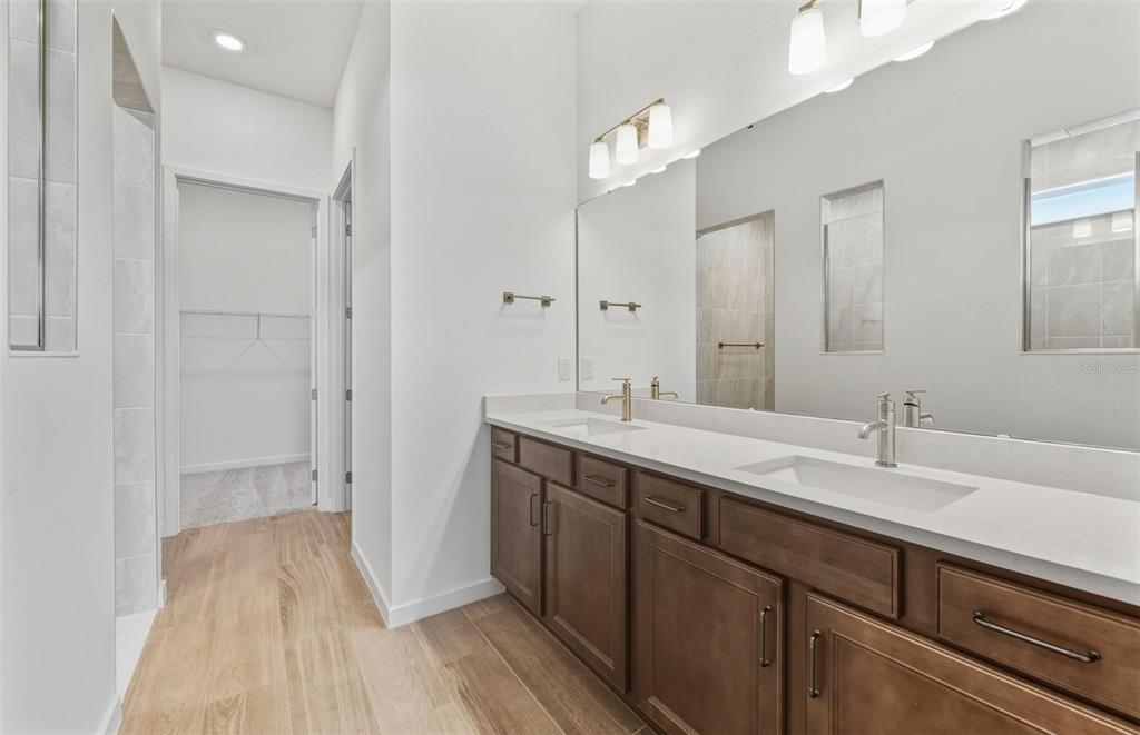 13647 Cyn Rdg Road Spring Hill, FL 34610 - Photo 11 of 30 a spacious bathroom with a sink and a mirror