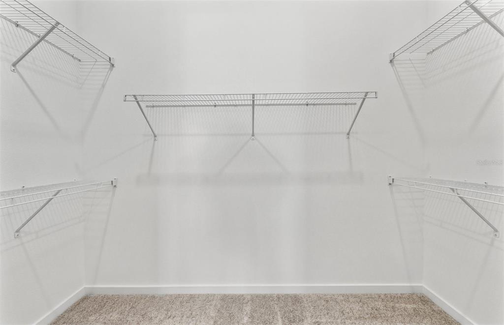 13647 Cyn Rdg Road Spring Hill, FL 34610 - Photo 12 of 30 a view of a room with racks on the wall