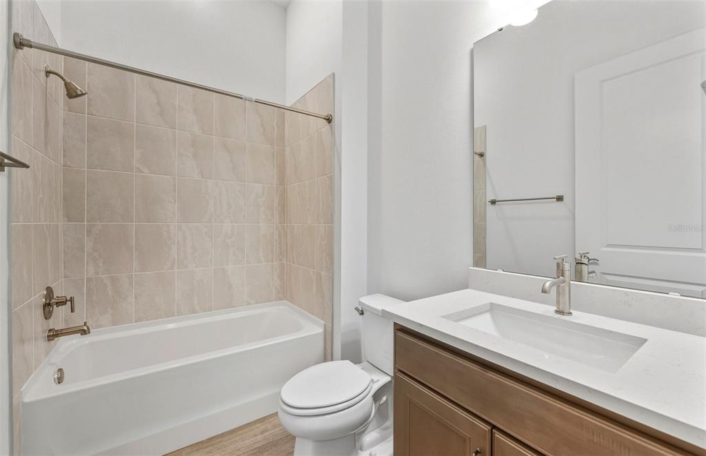 13647 Cyn Rdg Road Spring Hill, FL 34610 - Photo 13 of 29 a bathroom with a sink a toilet and a bathtub