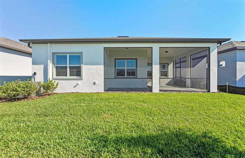 13647 Cyn Rdg Road Spring Hill, FL 34610 - Photo 17 of 30 front view of a house with a yard