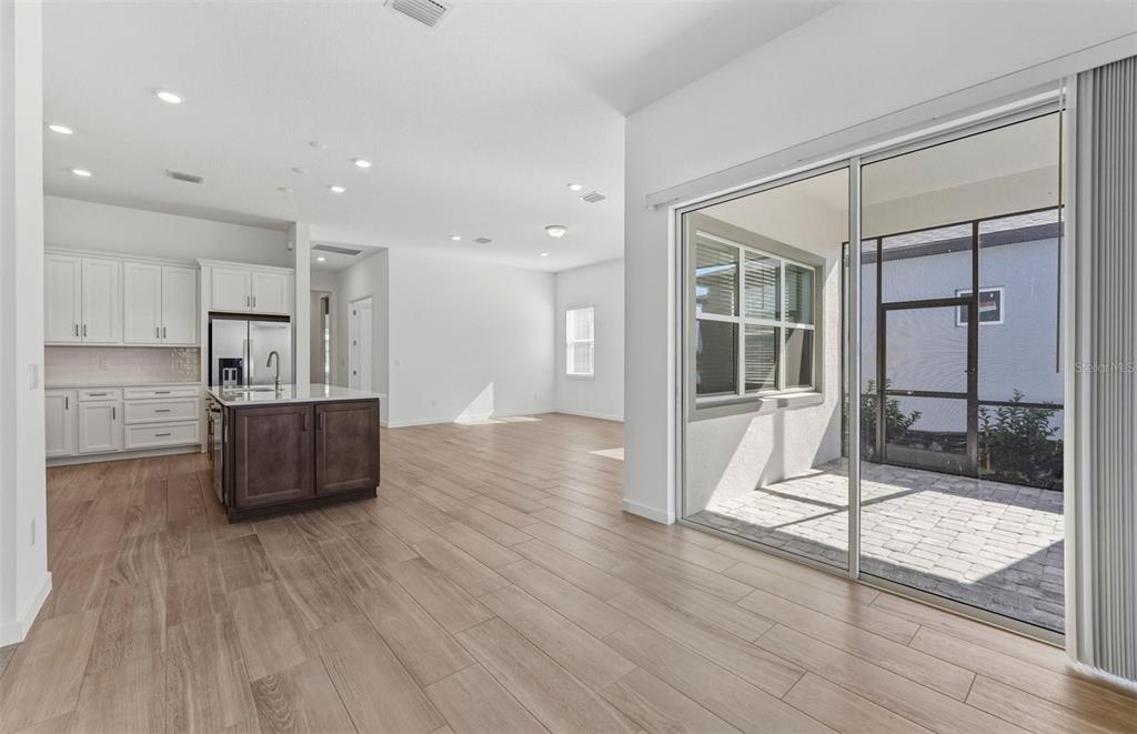 13647 Cyn Rdg Road Spring Hill, FL 34610 - Photo 4 of 29 a living room with wooden floor and furniture