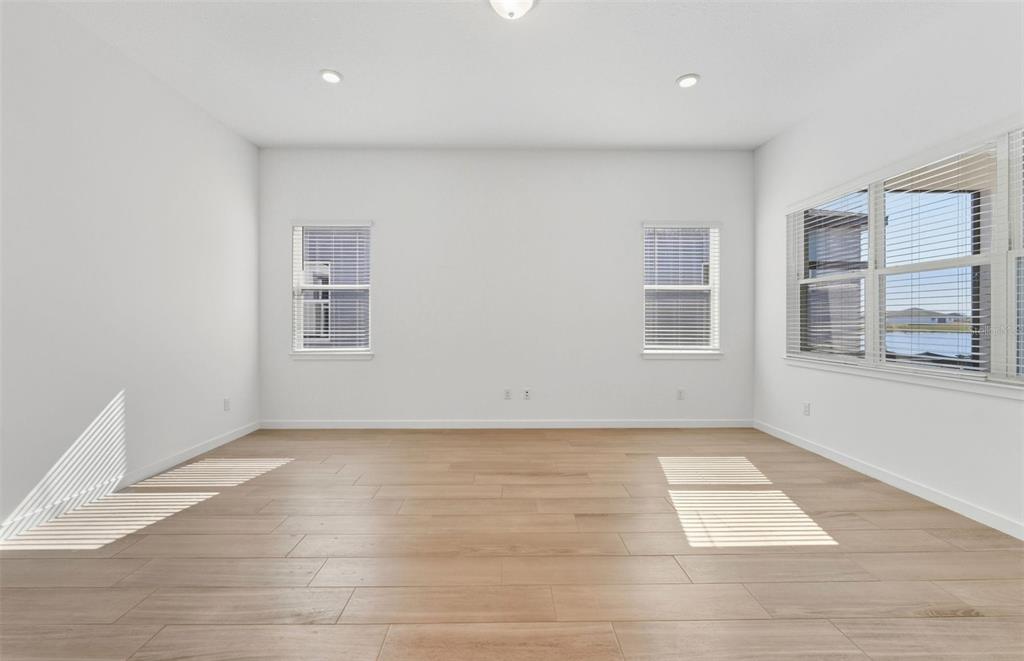 13647 Cyn Rdg Road Spring Hill, FL 34610 - Photo 6 of 29 an empty room with windows