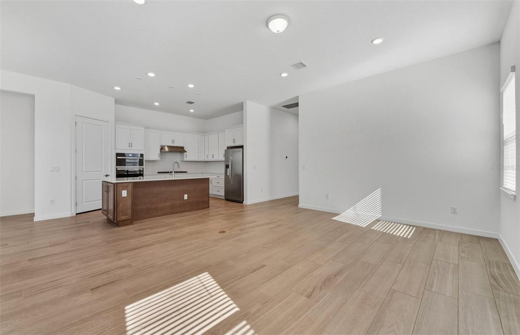 13647 Cyn Rdg Road Spring Hill, FL 34610 - Photo 8 of 30 a view of kitchen with wooden floor