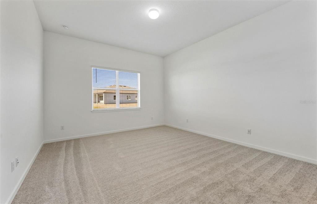 13647 Cyn Rdg Road Spring Hill, FL 34610 - Photo 10 of 30 an empty room with a window