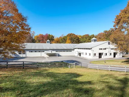 a view of an ocean with a house in the background