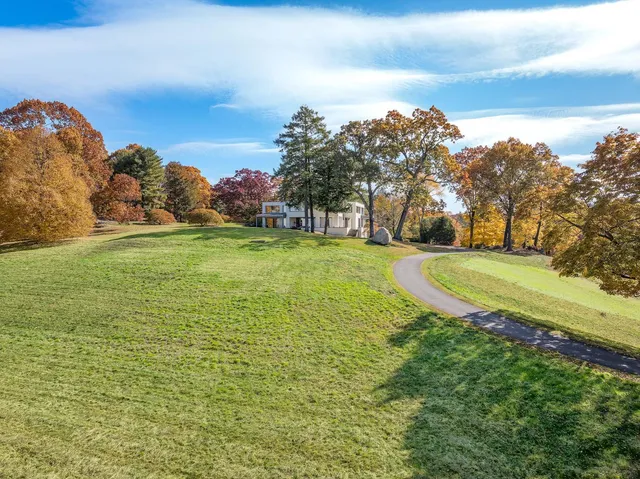 a view of a field with an ocean