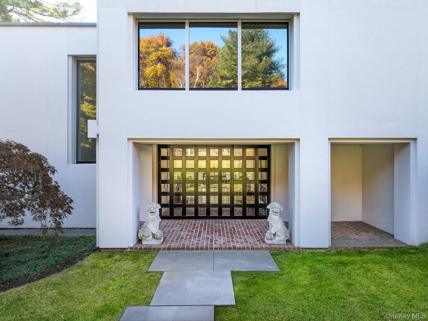 48 Raafenberg Road Sleepy Hollow, NY 10591 - Photo 4 of 37 a front view of a house with a garden
