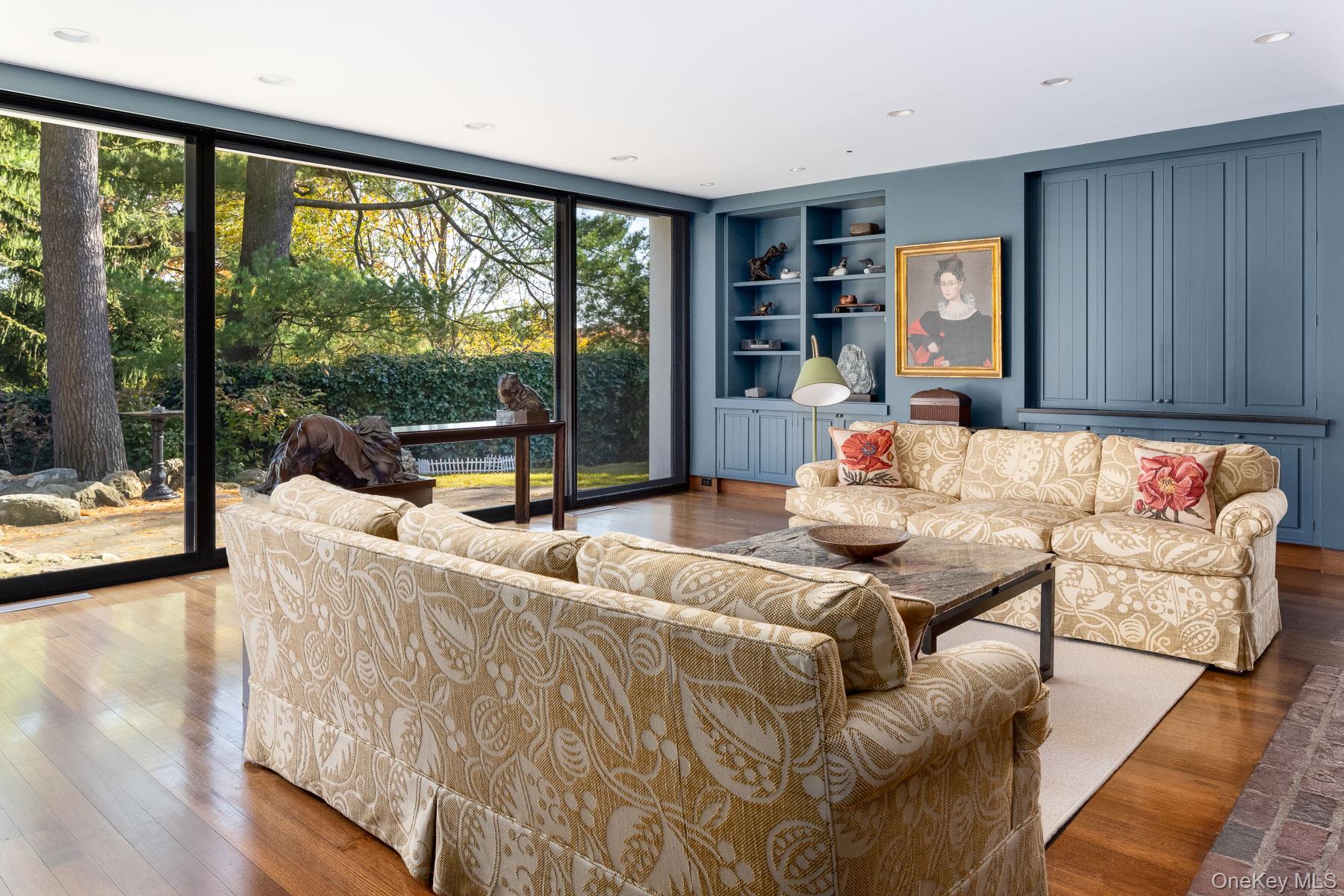 48 Raafenberg Road Sleepy Hollow, NY 10591 - Photo 8 of 37 a living room with furniture and a floor to ceiling window