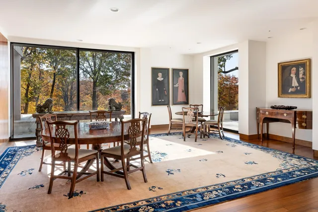 a view of a dining room with furniture window and outside view