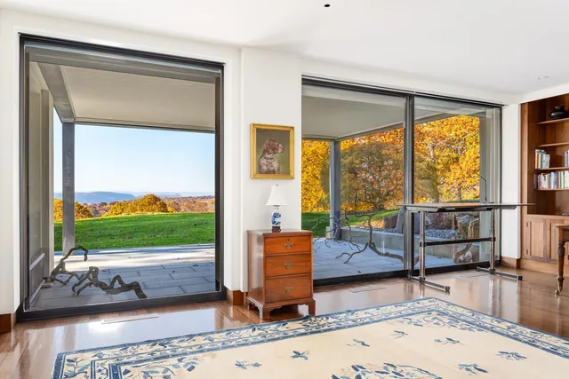 a living room with couch and a flat screen tv