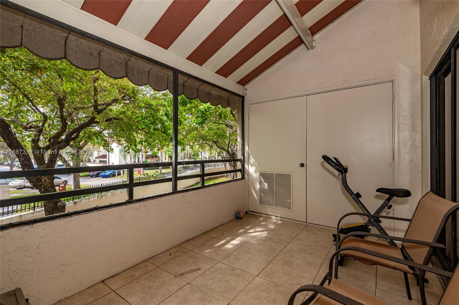20015 Northeast 3rd Court, Unit 6 Miami, FL 33179 - Photo 25 of 31 a view of a room with furniture and a window