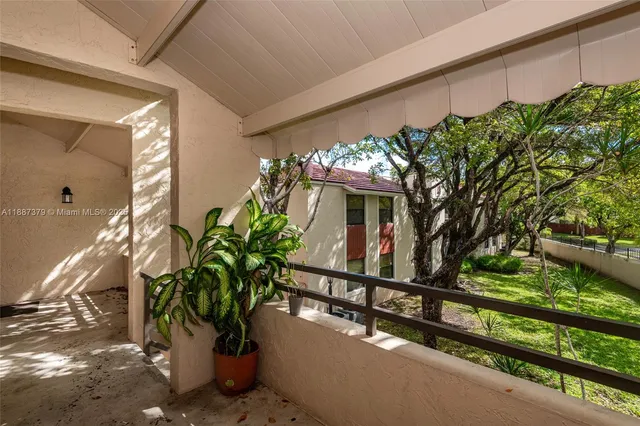 a view of a swimming pool with a table and chairs