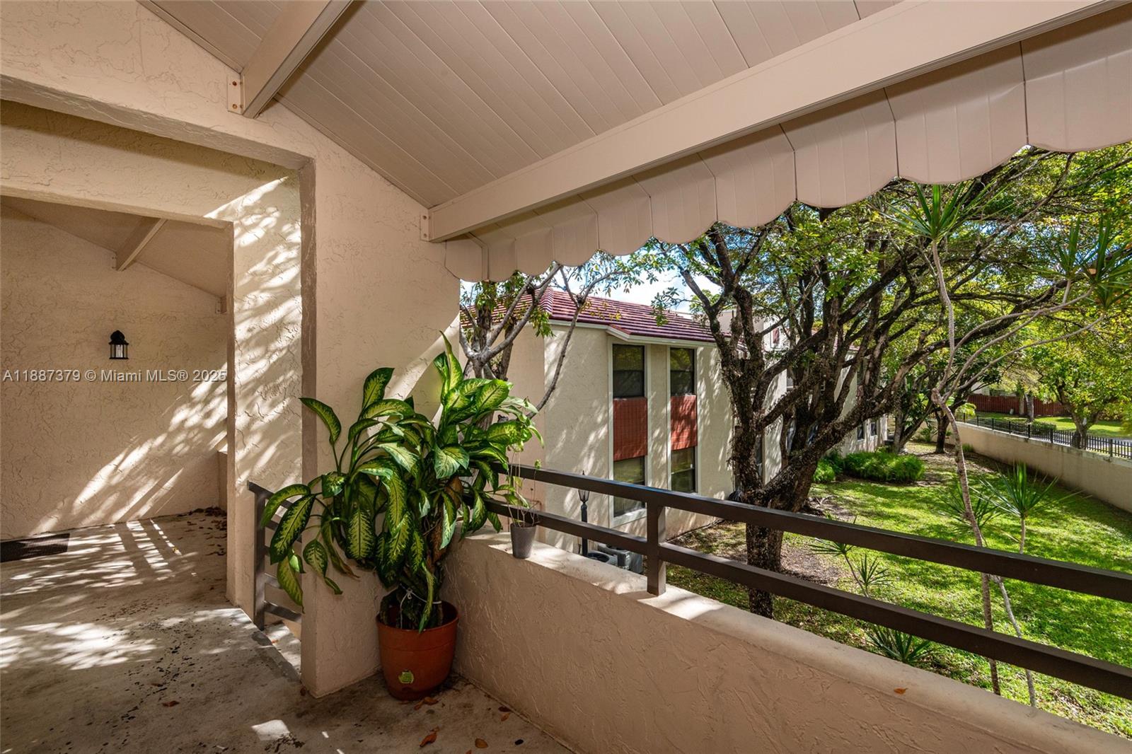 20015 Northeast 3rd Court, Unit 6 Miami, FL 33179 - Photo 27 of 31 a vase of flowers sitting on a floor