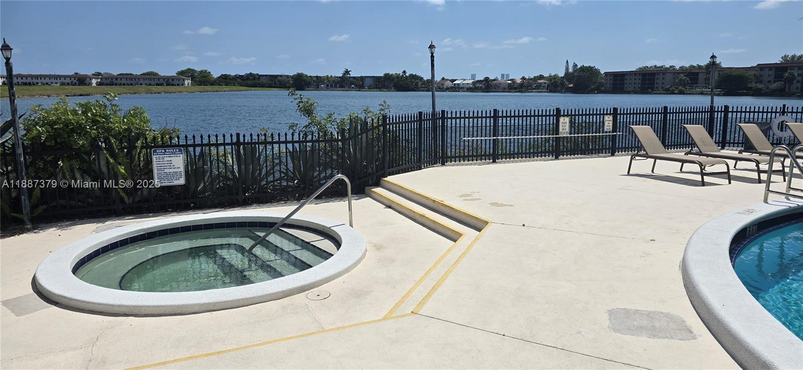 20015 Northeast 3rd Court, Unit 6 Miami, FL 33179 - Photo 30 of 31 a view of a swimming pool with a lounge chair
