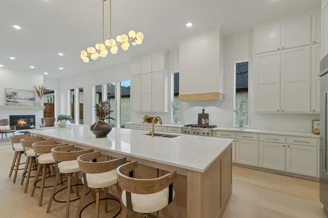a kitchen with a sink and cabinets