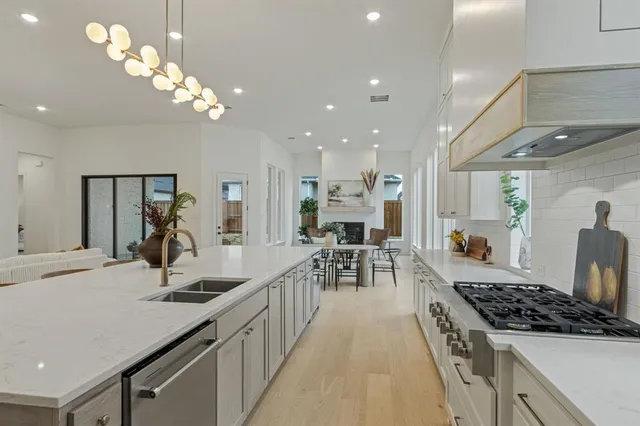 a kitchen with a dining table and chairs