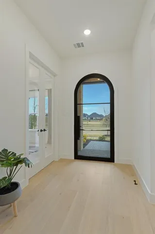 a view of an empty room and window