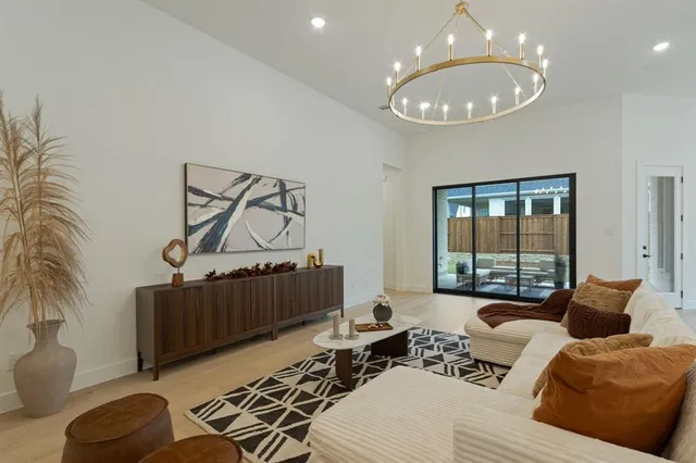 a bedroom with furniture and a large window