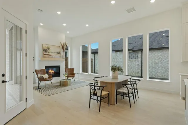 a dining room with furniture and a fireplace