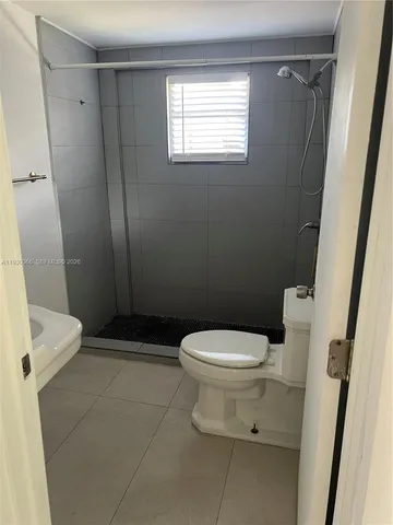 a kitchen that has a sink and a stove