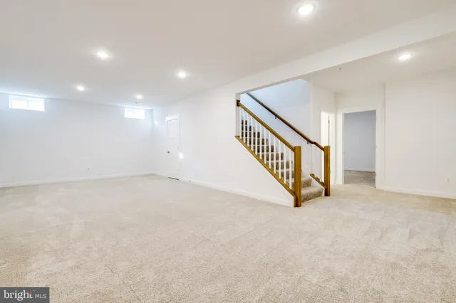 a view of an empty room with stairs