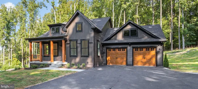 a front view of a house with a yard and porch
